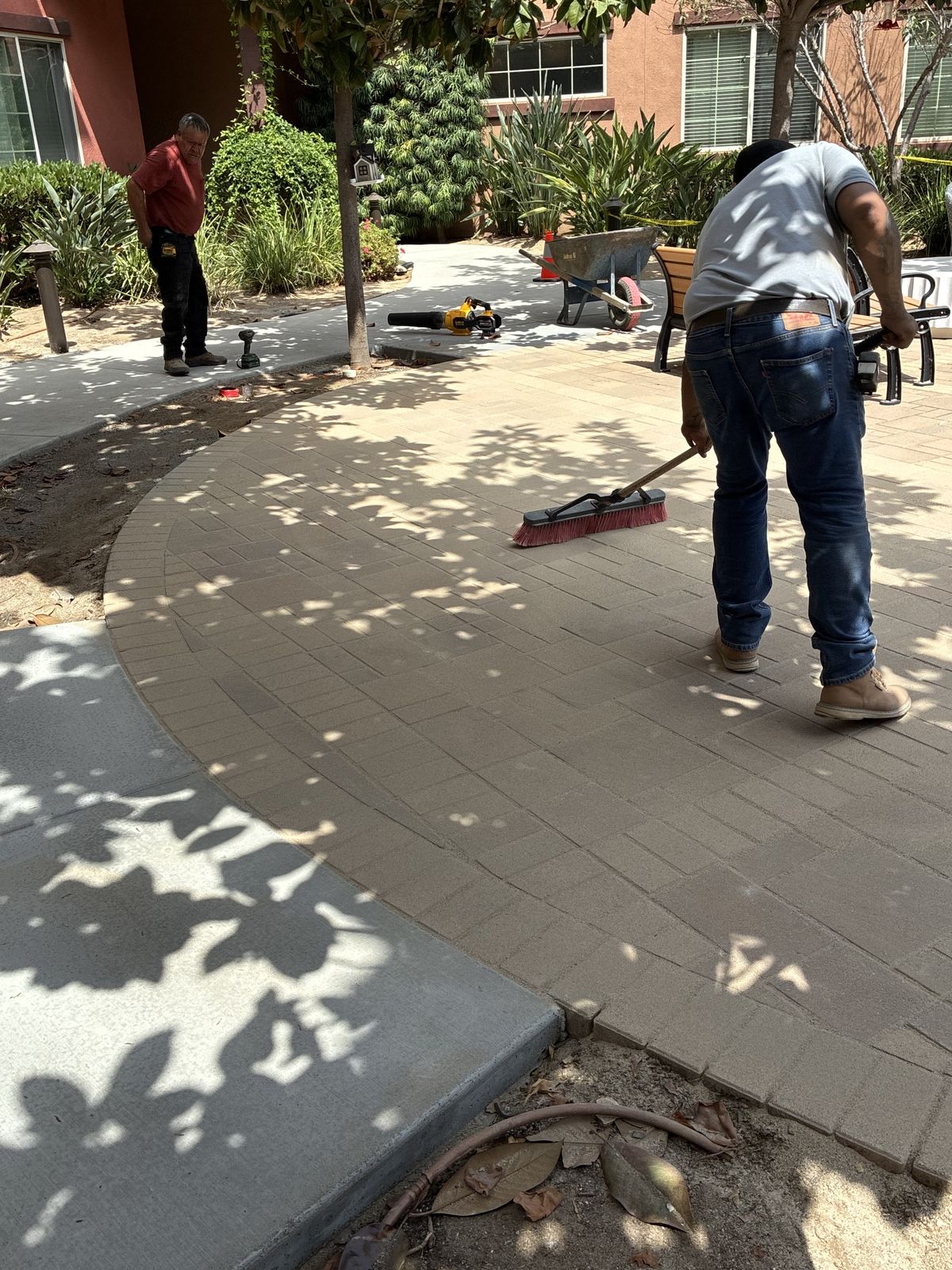 Pacific Coast Landscaping crew installing a paver walkway